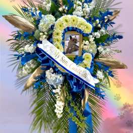 Blue and white funeral wreath with a pet photo and ribbon