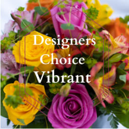 Bright mixed bouquet with yellow and magenta roses and multicolored blooms labeled Designers Choice Vibrant