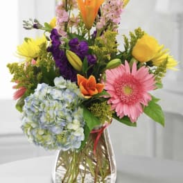 Colorful mixed bouquet in a clear glass vase