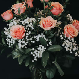 Bouquet of peach roses with white baby's breath