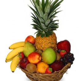Fruit basket with pineapple, bananas, apples, pears, grapes, and strawberries