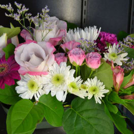 Mixed bouquet of pink, white, and purple flowers