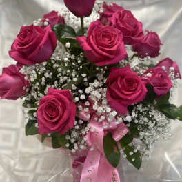 Bouquet of hot pink roses with baby's breath and a pink ribbon