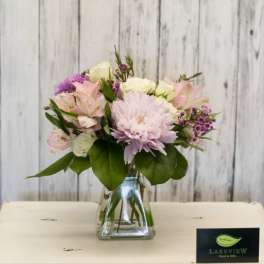 Pink and white mixed bouquet in a clear glass vase