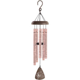 Hanging wind chime with pink tubes and a brown top and clapper