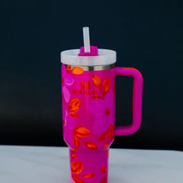 Pink Stanley tumbler with straw and floral pattern