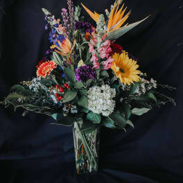 Colorful mixed bouquet in a clear glass vase