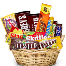 Basket filled with assorted candy bars and chocolate packs