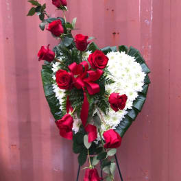 Heart-shaped standing spray with red roses and white flowers