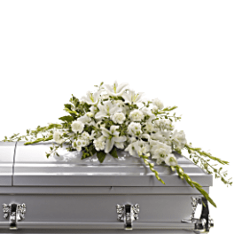 White floral spray on a silver casket