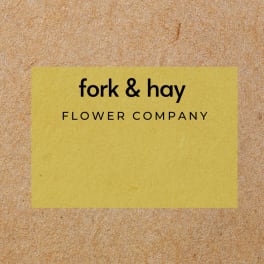 Yellow card with the text "fork & hay FLOWER COMPANY"