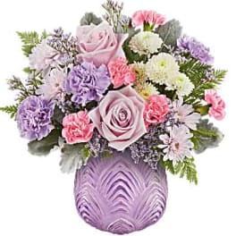 Lavender and pink mixed bouquet in a purple vase