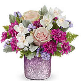 Pink rose bouquet with white flowers in a glittery purple vase