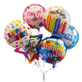 Cluster of colorful birthday balloons with printed messages