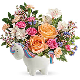 Bouquet of roses and alstroemeria in a unicorn-shaped vase