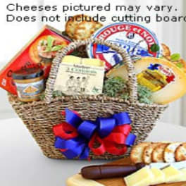 Gift basket with assorted cheeses and crackers tied with a red and blue bow