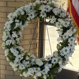 White daisy wreath on a standing easel