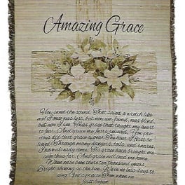 Decorative wall hanging with white flowers and the words Amazing Grace