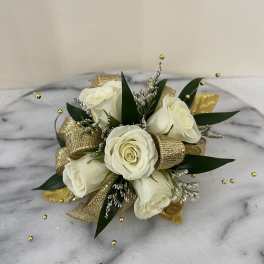 White rose bouquet with gold ribbon and decorative beads
