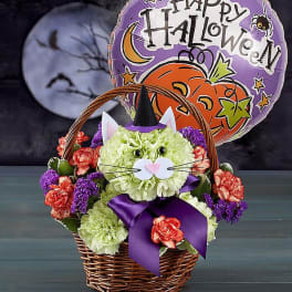 Halloween basket with a cat face made of flowers and a festive balloon