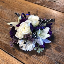 White, black, blue, lavender prom wrist corsage.