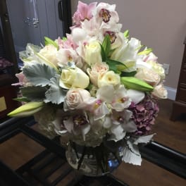 Bouquet of white and blush flowers in a glass vase
