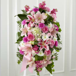 Pink and white floral standing spray with lilies and roses