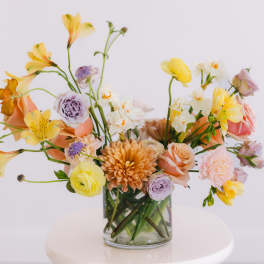 Mixed pastel bouquet in a clear glass vase