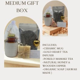 Gift box with a ceramic mug, honey, tea, soap, and a tea infuser