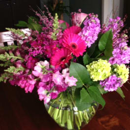 Pink and purple mixed bouquet in a glass vase