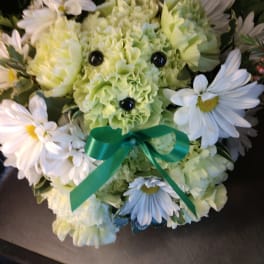 Green flower bouquet shaped like a teddy bear with white daisies and a ribbon