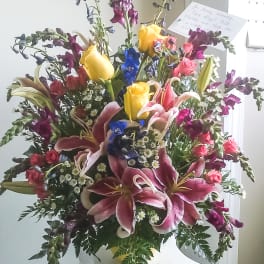 Large mixed bouquet with lilies, roses, and yellow tulips