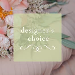 Designer’s choice floral arrangement with pale pink blooms