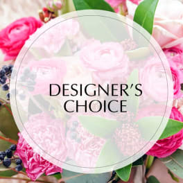 Pink floral arrangement with a Designer's Choice label