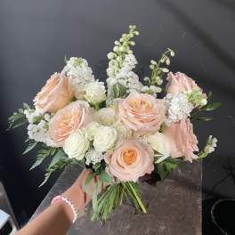 Peach and white rose bouquet with white filler flowers