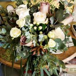 Bouquet of white and blush roses with eucalyptus greenery
