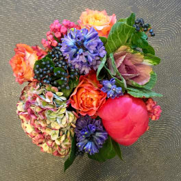 Colorful bouquet with roses, hydrangea, and purple blooms