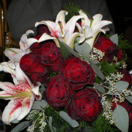 Bouquet of red roses and white lilies with eucalyptus
