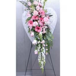 Pink and white standing floral spray on an easel