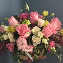 Bouquet of pink and white roses with green and yellow blooms