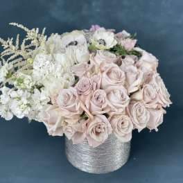 Blush and white rose bouquet in a silver textured vase