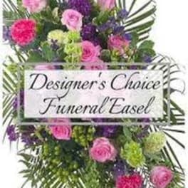 Colorful funeral easel spray with pink and purple flowers