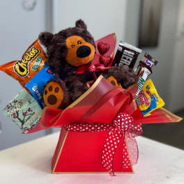 Teddy bear gift arrangement with assorted candy in a red box