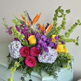 Bright mixed bouquet with roses, hydrangeas, and bird of paradise