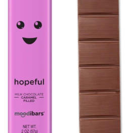 Pink chocolate bar wrapper beside a segmented milk chocolate bar