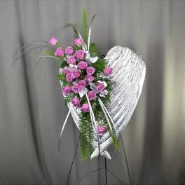 Pink rose spray on a silver heart-shaped stand