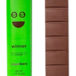 Green chocolate bar wrapper beside a segmented milk chocolate bar