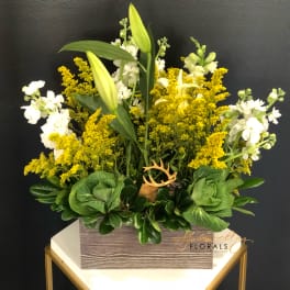 Yellow and white floral arrangement in a rectangular box