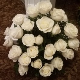 White rose bouquet arranged in a low cluster.