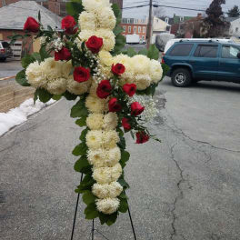 Cross-shaped floral standing spray with white mums and red roses